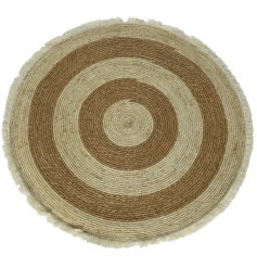 A super stylish round corn leaf rug with fringes and a stripe design.