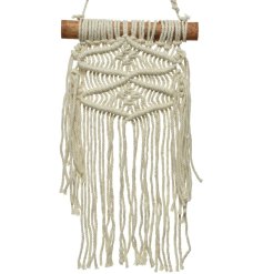 A beautifully woven macrame hanger made from cotton. Hung from a chunky, natural wooden pole. 
