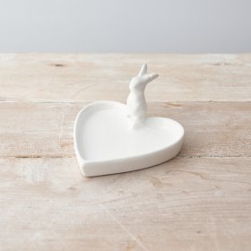 A chic heart shaped trinket dish with an adorable bunny figure.