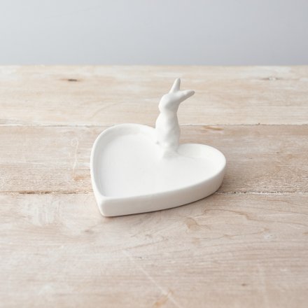 A chic heart shaped trinket dish with an adorable bunny figure.