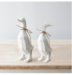 A charming polyresin duck ornament with a distressed finish and rustic jute bow. 