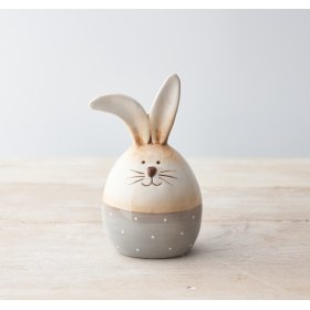 A charming bunny egg decoration with painterly details and a polka dot band. 