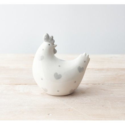 A stylish grey and white chicken ornament with polka dots and hearts.