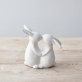 An adorable kissing bunny ornament with a glossy white finish. 