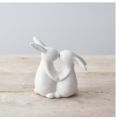 An adorable kissing bunny ornament with a glossy white finish. 