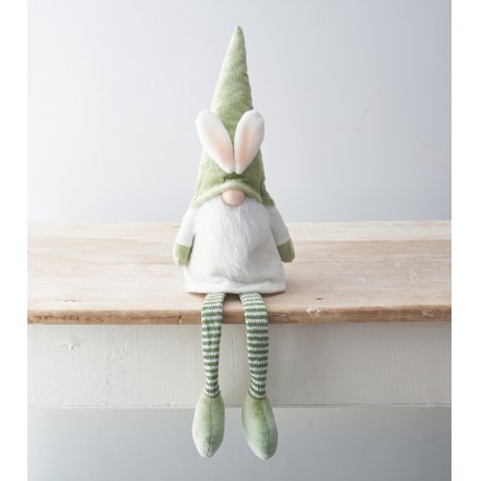A unique and adorable shelf sitting Gonk decoration with dress up bunny ears. 