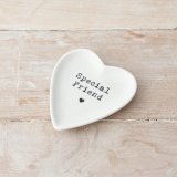 A pretty heart shaped trinket dish with a stamp style special friend slogan. 