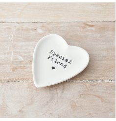 A pretty heart shaped trinket dish with a stamp style special friend slogan. 
