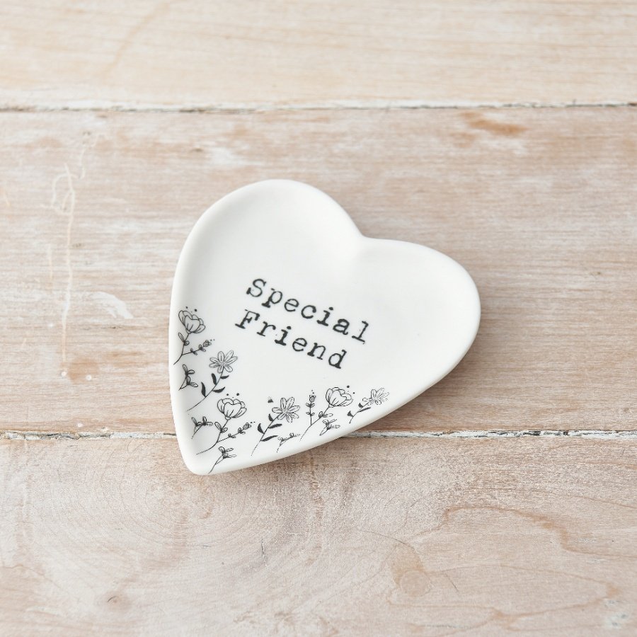 A pretty heart shaped trinket dish with a floral design and stamp style Special Friend slogan.