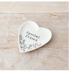 A pretty heart shaped trinket dish with a floral design and stamp style Special Friend slogan.