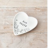 A heart shaped trinket dish decorated with a pretty floral design. Complete with a stamp style slogan.
