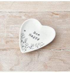 A heart shaped trinket dish decorated with a pretty floral design. Complete with a stamp style slogan.