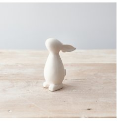 A contemporary and chic standing bunny ornament with a matte white finish.
