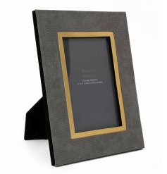 An elegant photo frame with a grey weave design and gold detailing. Perfect for showcasing your favourite images.
