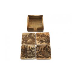 A set of 4 chunky wooden coasters, each with an engraved forest toile design. Complete with storage box.