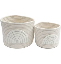 A set of 2 natural woven baskets, each with a contemporary arch design in a fluffy teddy fabric. 