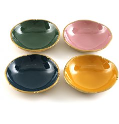 An assortment of 4 jewel coloured trinket dishes, each with a luxurious gold edge.
