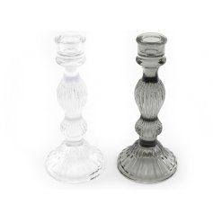 An assortment of 2 contemporary glass candle holders in clear and grey colours.