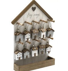 An assortment of 20 house key rings with a large house display unit.