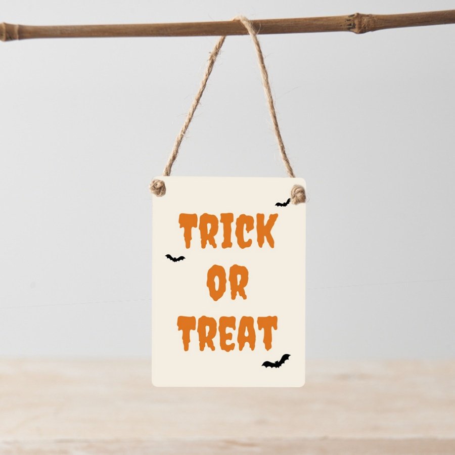 Trick or Treat. A spooky mini metal sign with jute string hanger.