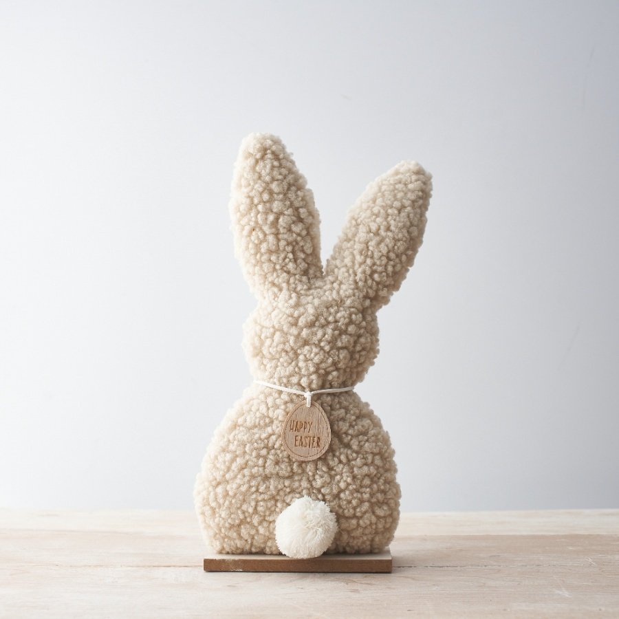 A stunning bunny ornament with gorgeous soft fabric and a fluffy white tail.