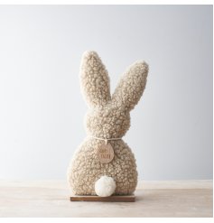A stunning bunny ornament with gorgeous soft fabric and a fluffy white tail.