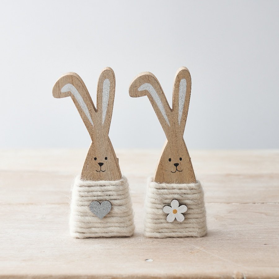 An assortment of 2 charming wooden bunny ornaments. Each is wrapped with wool and complete with a little wooden charm