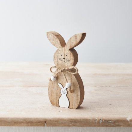 A rustic wooden bunny ornament with miniature white wooden bunny jigsaw. Complete with a rustic jute bow and beads. 