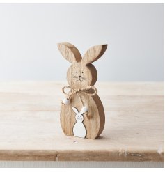 A rustic wooden bunny ornament with miniature white wooden bunny jigsaw. Complete with a rustic jute bow and beads. 