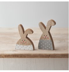 An assortment of 2 wooden rabbit freestanding decorations with a grey/white polka dot pattern and cute rosy cheeks!