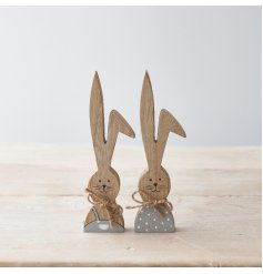 An assortment of 2 wooden bunnies in grey and white painted outfits. Beautifully detailed with jute string bows 