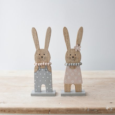 An assortment of 2 charming wooden bunny ornaments, each with a beaded necklace. 