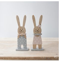 An assortment of 2 charming wooden bunny ornaments, each with a beaded necklace. 