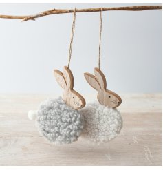 An assortment of 2 chic wooden bunny ornaments, each with a fluffy sherpa body in grey and white. Complete with a cute p