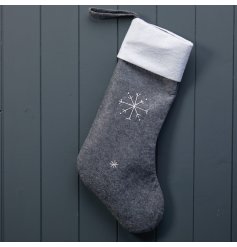 A simple Scandinavian inspired felt stocking with a stitched snowflake print. 
