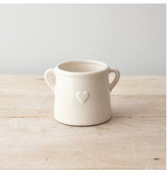 A simple yet stylish eared planter with an embossed Heart detail.