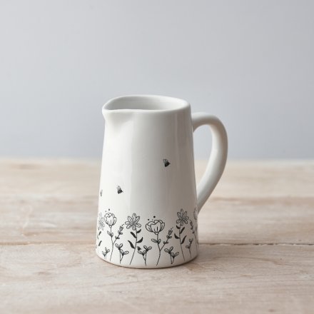 A charming ceramic jug with a beautiful wild flowers and bee design. 