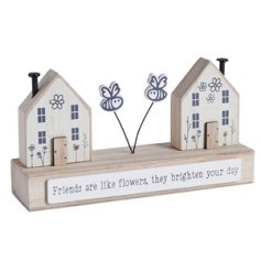 Friends are like flowers, they brighten your day. A charming wooden scene with houses, bees and friendship slogan.