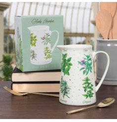 A fine china jug decorated with a variety of beautifully illustrated and labelled garden herbs.