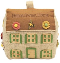 A charming country cottage doorstop with beautiful embroidered bees and flowers.