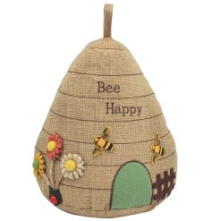 A charming beehive design doorstop with beautiful bee fabric badges and 3D flowers.