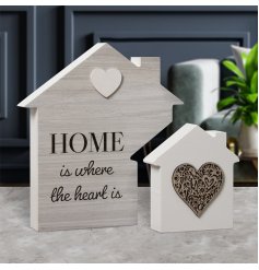 Home is where the heart is. A stylish wooden house plaque with a popular sentiment slogan. 