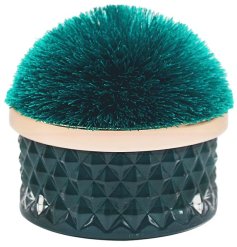 An elegant, beautifully coloured jewel green candle pot with pom pom lid.