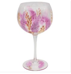 A colourful gin glass with a hand painted pampas design