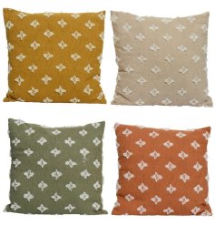 An assortment of 4 textured cushions in a mix of earthy tones. Each has a natural patterned tuft. 