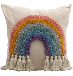 A beautiful fabric cushion with a colour rainbow pattern, finished with tassels. 