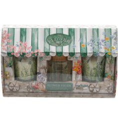 A flower shop gift set containing  two candles and a diffuser.