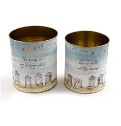 Stay organised with this set of 2 storage tins, each with a beach themed slogan and beach hut and bunting design.