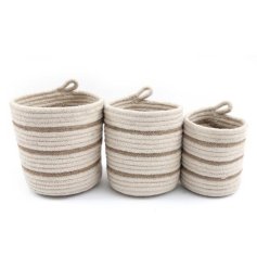 A set of 3 jute hanging baskets in a striped design.