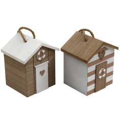 An assortment of 2 wooden beach hut doorstops. Each is rustic in design with natural and white washed finishes 